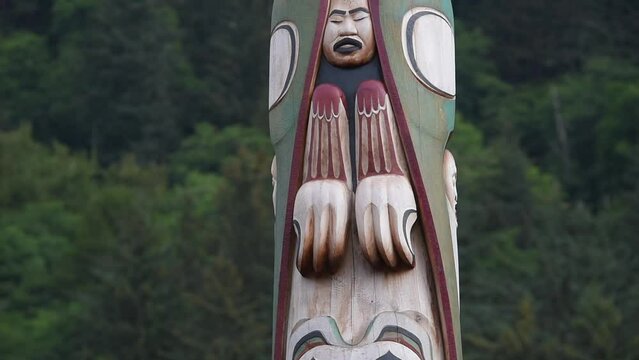 Closeup shot of a Native American wooden totem pole in Juneau, capital of Alaska, United States