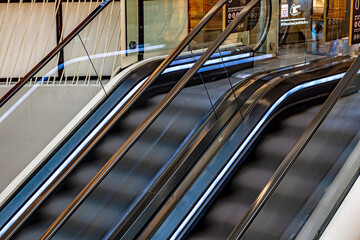 Glass-walled escalator in a station