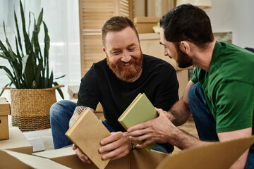 Two happy men, a gay couple in love, sit with books, embracing their fresh start with joy.