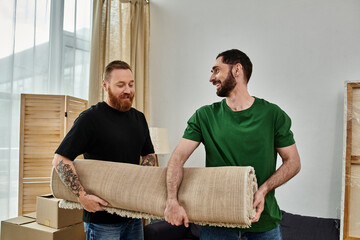 A gay couple in love, surrounded by moving carpet, standing together in their new home.