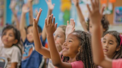 Fototapeta premium Hands raised by students in response to their teacher