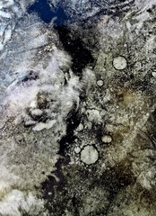 Sheet of galvanized iron is covered with a layer of printing ink. Metal texture and paint. Background Image Industry
