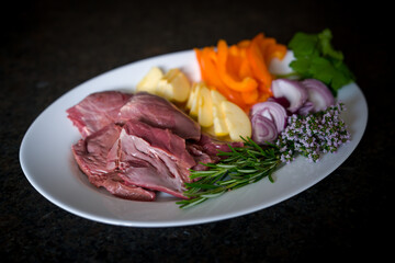 healthy and valuable food products - a fresh heart from a reddeer yearling with rosemary, thyme,...