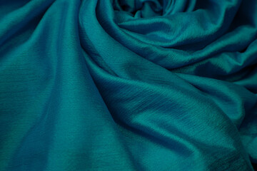 Closeup of blue silk cloth fabric.