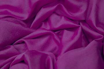 Closeup of pink silk cloth fabric.