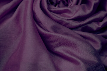 Closeup of purple silk cloth fabric.