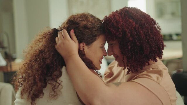 Sweet and tender look between two women in love. Home affection. Free love to all sexual orientation. Gay young relationship.
