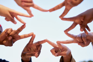 Star shape, hands and business people with teamwork, cooperation and synergy with blue sky. Group,...