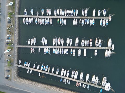 Aerial top view of moored boats on the harbor of Assens