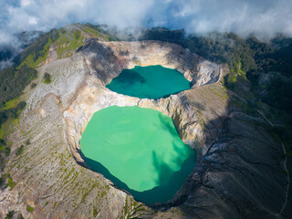 Aerial view of Kelimutu National Park's crater lakes on Flores Island, Indonesia. © Wirestock