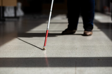 Blind person with white cane, Disability concept