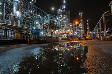 Oil​ refinery​ night plant and tower of Petrochemistry industry in oil​.