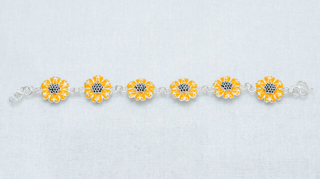 Silver jewelry display on white background