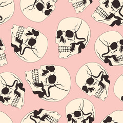 Abstract seamless pattern with skulls on a light pink background. Halloween seamless pattern with skulls. Lots of skulls. Spooky and cute pattern for printing and textiles for Halloween