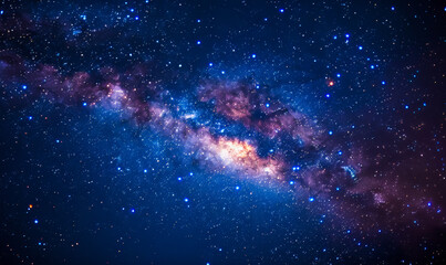 Obraz premium Vibrant Milky Way Galaxy at Night with Multicolored Stars Shining Brightly in a Starry Sky, Captured in a Low Angle Shot, Perfect for Astronomy Enthusiasts and Night Sky Photography