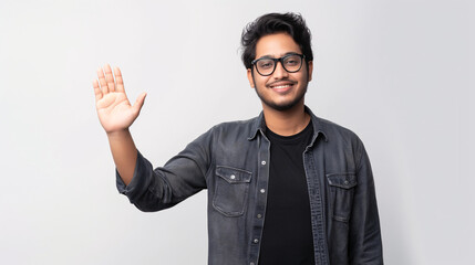 Casual Young Man with Glasses Smiling and Waving Hand in Friendly Greeting