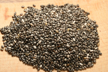 organic chia seeds in bulk on a wooden board