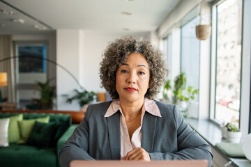 Portrait of a professional African American woman at modern office desk