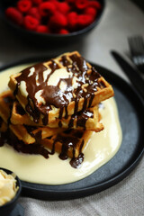 Dutch waffles with vanilla sauce, chocolate and berries.