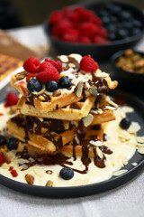 Dutch waffles with vanilla sauce, chocolate and berries.