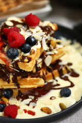 Dutch waffles with vanilla sauce, chocolate and berries.