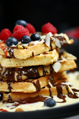 Dutch waffles with vanilla sauce, chocolate and berries.