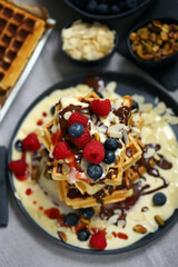 Dutch waffles with vanilla sauce, chocolate and berries.