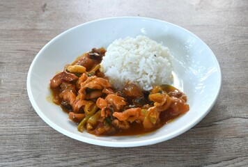 stir-fried squid with salt egg topping plain rice on dish
