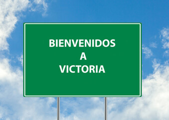 Siguiente salida Bienvenidos a victoria una señal verde sobre fondo de cielo azul. Colección de señales de tráfico conceptuales