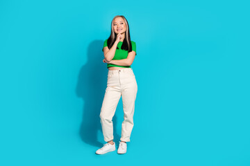 Full body portrait of cute young girl look empty space wear t-shirt isolated on turquoise color background