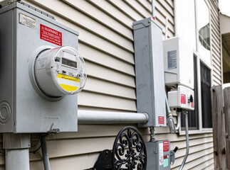 Utility electricity bill meter is connected to photovoltaic system inverter and a quick disconnect...