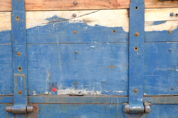 stacked blue wooden planks, nailed. This image is suitable for use as a background or wallpaper. old wooden door.