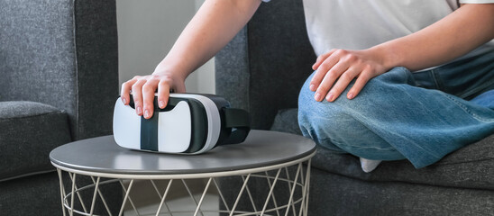 VR.woman uses VR glasses in everyday life at home, augmented reality, VR AR technologies, mixed...