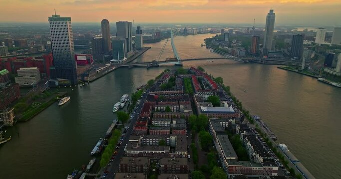 Aerial view Rotterdam city in The Netherlands. Destination in Holland. Erasmusbrug and river Maas urban city view at sunset