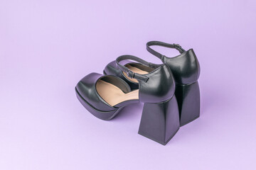 Modern Black Platform Heels on Pastel Purple Background