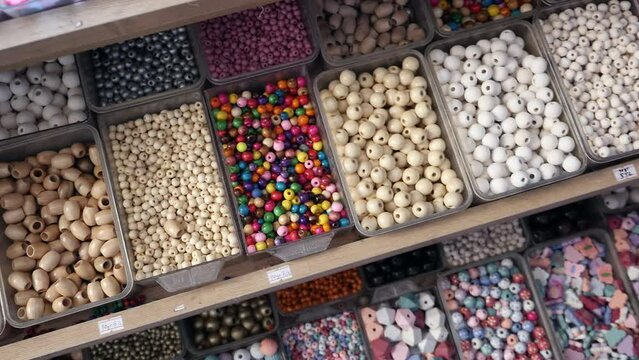 Beads of various sizes and colors at the souvenir seller, beads for making bracelets, beads at the bead seller,