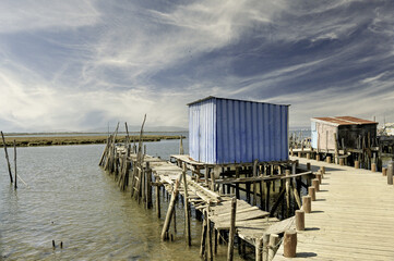 Fototapeta premium Puerto Palafitico de Carrasqueira with Blue Huts