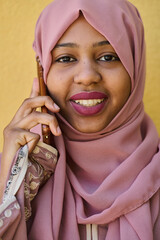 Digital Connection: Close-up Portrait of a Middle Eastern Teenage Muslim Girl Using Smartphone