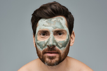 Bearded man wearing a facial mask, skincare. - Powered by Adobe