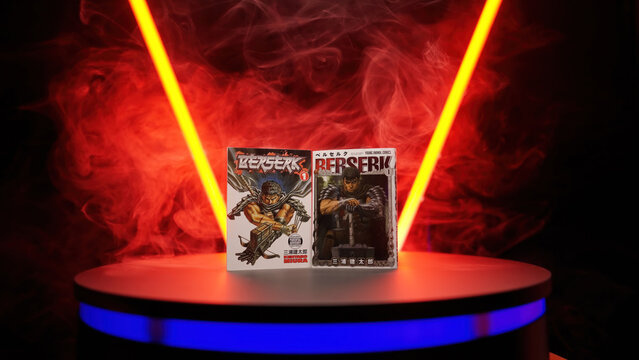 Studio shot with tubes and smoke of Japanese and English translation of manga Berserk