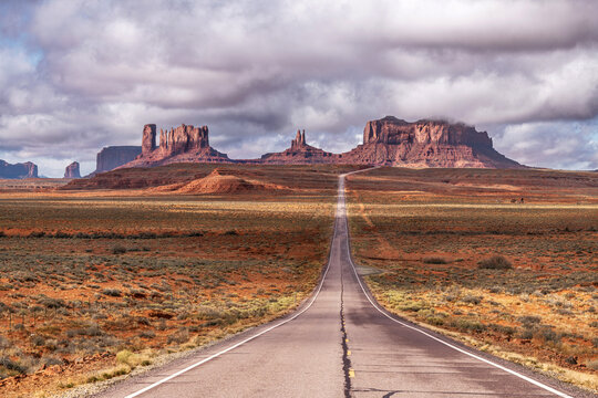View of Forrest Gump Highway in Monument Valley shows the dramatic stormy weather hugging the valley.