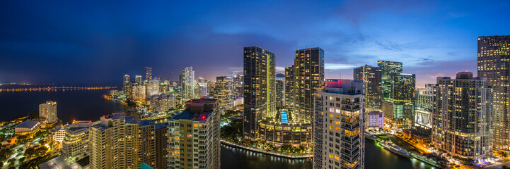 Aerial view of futuristic and luxurious city skyline at night, Miami, Florida, United States.