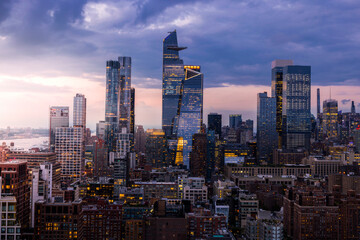 Aerial view of modern downtown skyline at sunset, Hudson Yards, New York City, United States.