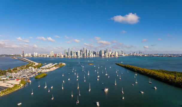 Aerial view of beautiful beach with boats and skyscrapers, Virginia Key, Miami, United States.