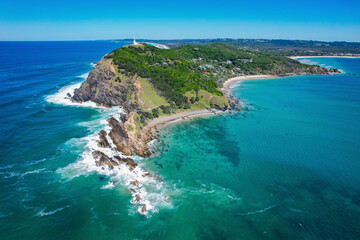 Aerial view of beautiful sandy beach and blue ocean at Cape Byron State Conservation Area, Byron Bay, Australia.