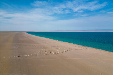 Aerial view of sandy shore and blue water at Khyargas Lake, Uvs, Zavhan, Mongolia.