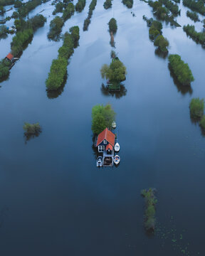 Aerial view of floating houses and boats on river, Scheendijk, The Netherlands.