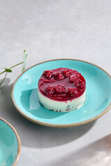 Cherry Cheesecake Delight on a Turquoise Plate, Elegant Dessert Presentation