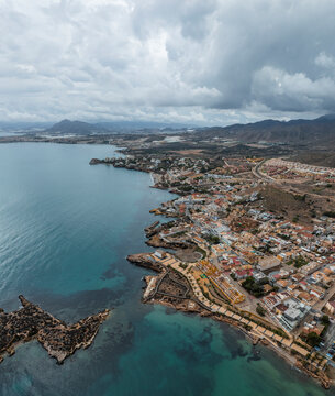 Aerial view of seaside town with church, Isla Plana, Murcia, Spain.