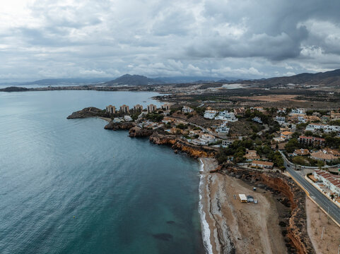 Aerial view of beautiful coastal cliff patterns at Isla Plana, Murcia, Spain.